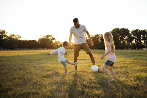family playing soccer family playing soccer