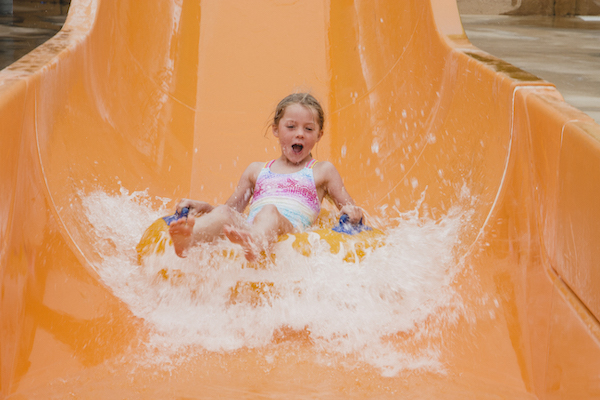 Kids going down the waterslide