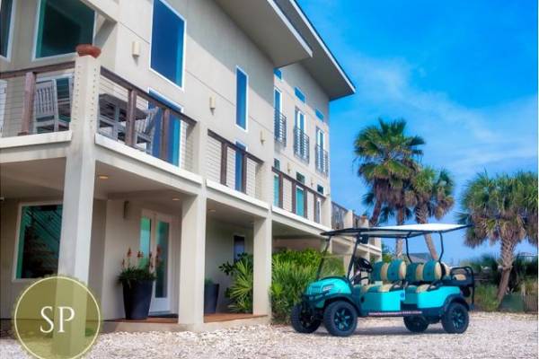 Golf cart in front of a Starkey Property rental