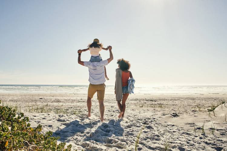 A family enjoy a day on the beach