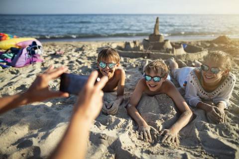 Kids Smiling For Photo By Sandcastle - Texas Sandfest